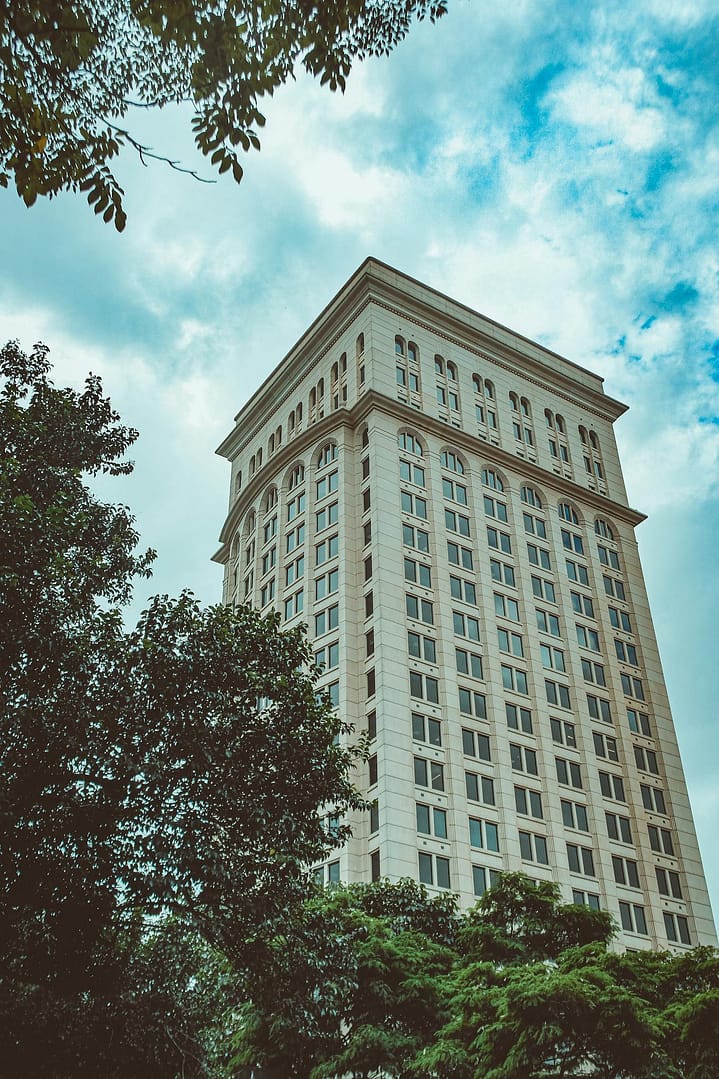 Modern tall building against blue sky